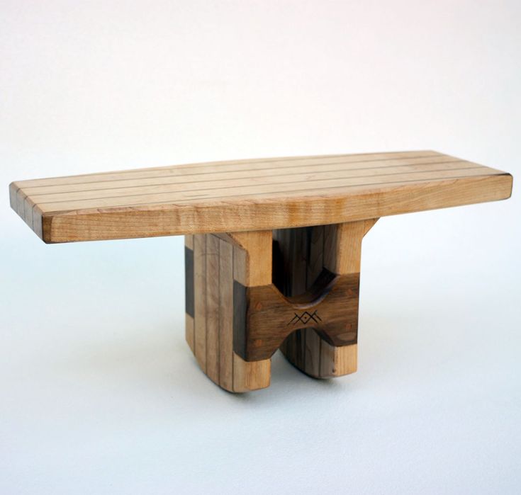 a wooden bench made out of pieces of wood