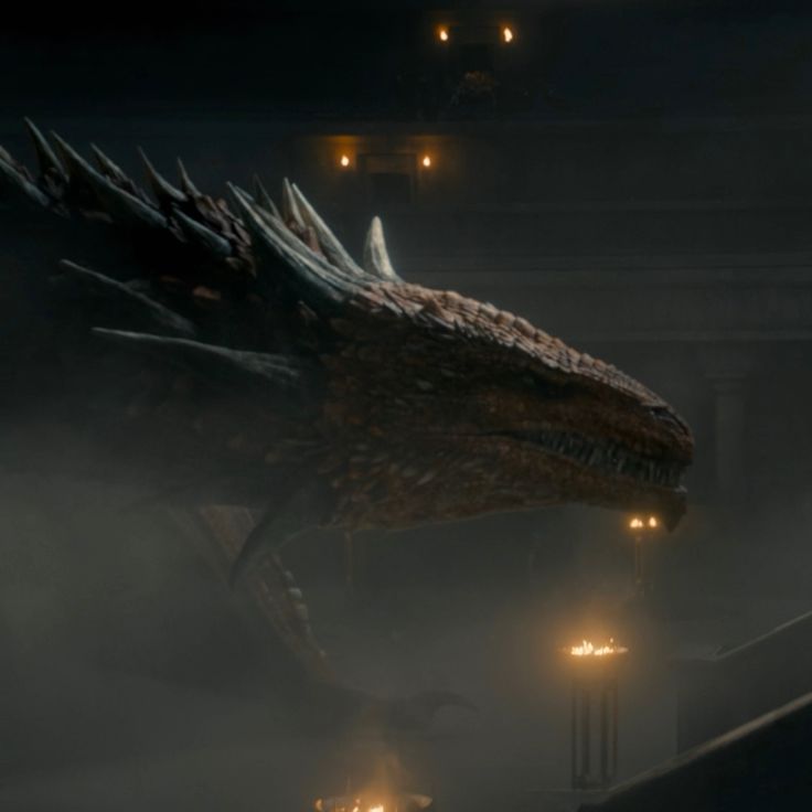 a large dragon in the middle of a foggy area with lights on it's head