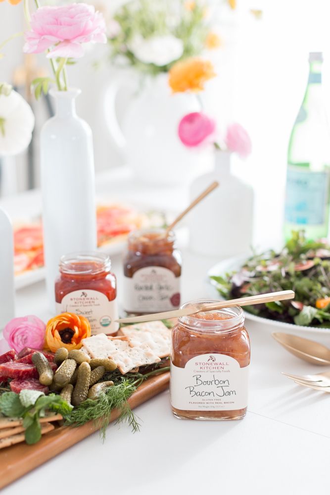 a table topped with lots of food and condiments