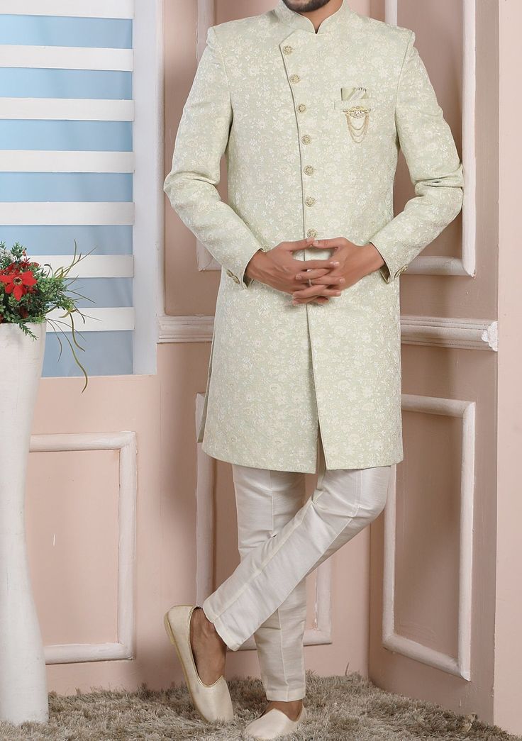 Ready-Made Sherwani With Trouser. Jacquard Brocade Fabric Top. Art Dupion Aligarhi Ready Made Trouser. Crafted in Chinese Collar Neck, and Full Sleeve. Satin Lining with Plain Work. High-Quality Matching Buttons. Please Note: The footwear shown in the picture is for presentation and photography purpose only. Color: There might be slight color variation due to lightings and flashes while photo shooting. The color may also vary because of different screen resolutions. Wash Care: Dry Clean Only. Brocade Unstitched Suit For Wedding, Straight Kurta Style, Brocade Unstitched Suit With Straight Kurta For Wedding, Formal Sets In Raw Silk With Chikankari Embroidery, Formal Raw Silk Sets With Chikankari Embroidery, Fitted Long Sherwani With Chikankari Embroidery, Formal Sets With Chikankari Embroidery On Raw Silk, Formal Pista Green Set With Zari Work, Formal Pista Green Sets With Chikankari Embroidery, Traditional Full-length Salwar Kameez For Wedding