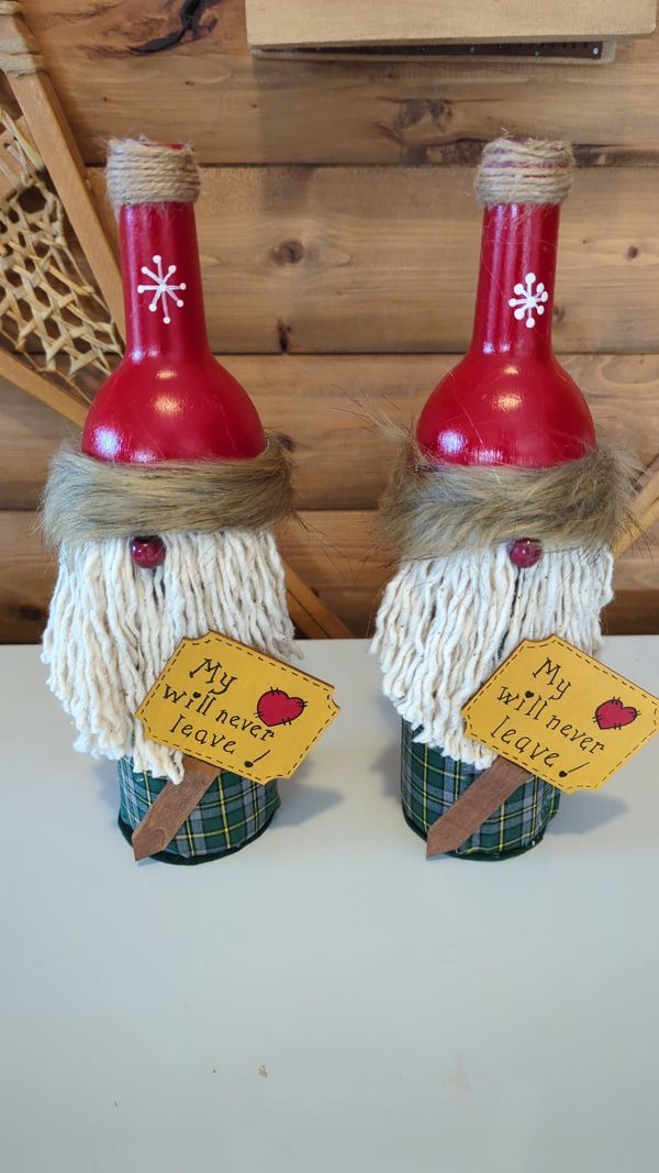 two red and white gnomes with signs on their heads