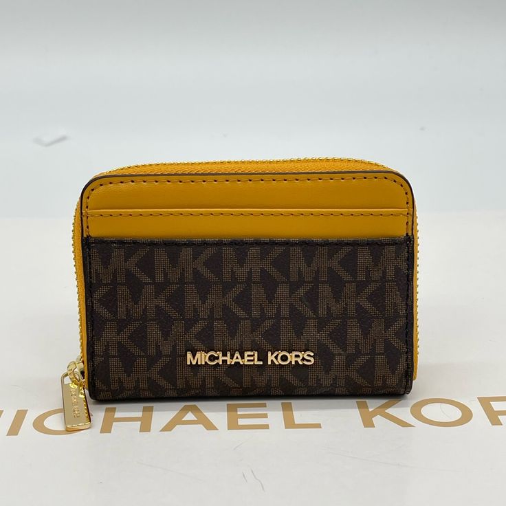 Brand New With Tag Michael Kors Jet Set Travel Md Za Card Case Color: Marigold Gold Tone Logo And Hardware 2 Exterior Front Card Slots 2 Exterior Back Credit Card Slots 4 Interior Credit Card Slots Apprx Dimensions 4.5w X 3.25h X 1d Luxury Gold Coin Purse With Card Slots, Luxury Gold Wallets With Card Slots, Gold Luxury Wallets With Card Slots, Gold Bifold Coin Purse For Everyday Use, Gold Wallet With Coin Pocket For Everyday Use, Luxury Gold Wallet With Interior Card Slots, Gold Leather Bags With Card Slots, Luxury Gold Travel Coin Purse, Luxury Gold Coin Purse For Travel