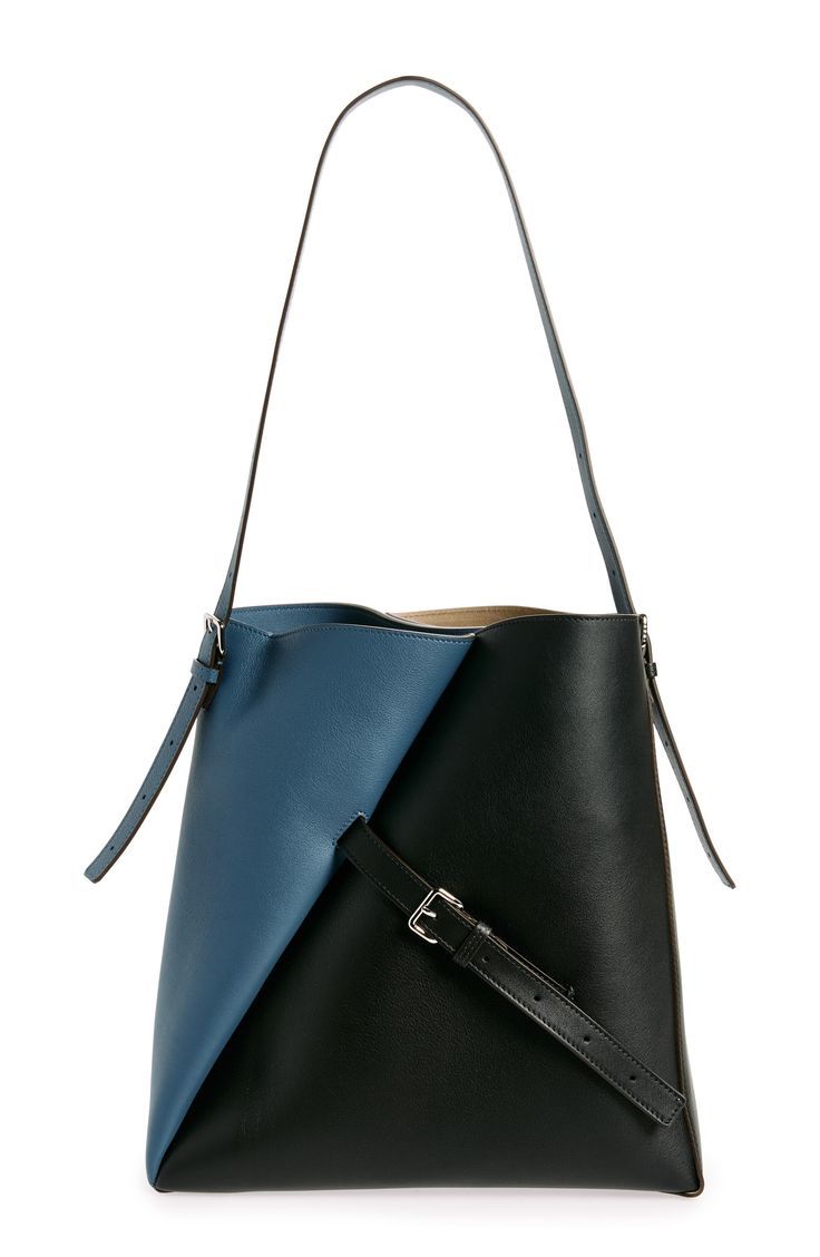 Two-tone colorblocked leather and a diagonally inset buckle strap highlight Marni's innovative approach to fashion with this spacious hobo bag. Open top Shoulder strap Interior wall slip pocket Leather Made in Italy Designer Handbags Leather Crossbody Bucket Bag With Magnetic Closure, Modern Hobo Bag With Leather Handles For Office, Modern Everyday Bucket Bag With Magnetic Closure, Modern Hobo Bag With Detachable Strap For Office, Modern Hobo Bag With Removable Pouch For Office, Modern Crossbody Bucket Bag, Modern Bucket Bag With Detachable Strap, Modern Top Handle Hobo Bag For Office, Modern Bucket Bag With Detachable Strap For Work