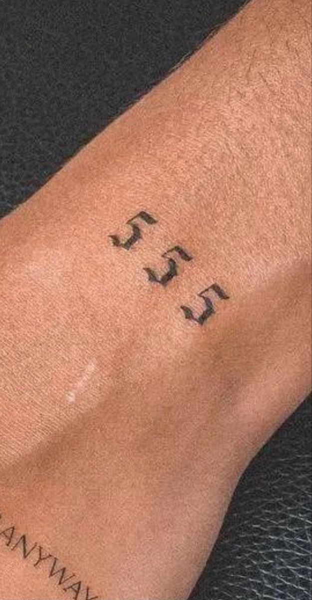 a person with a tattoo on their arm