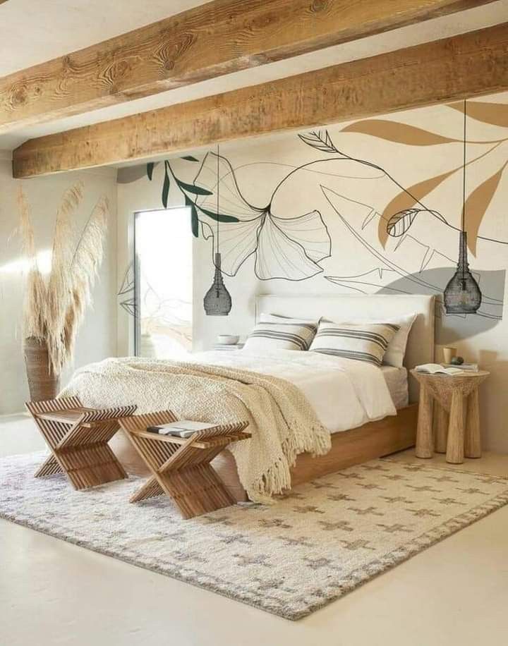 a bedroom with white walls and flooring has an artistic mural on the wall behind the bed