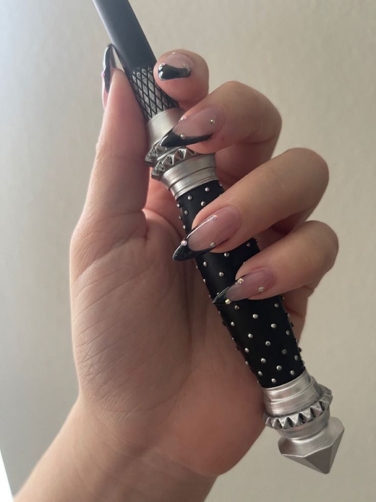 Black French tip stiletto nails with rhinestone details holding Narcissa Malfoy nee black nails Narcissa Malfoy Cosplay, Black Inspired Nails, Draco Malfoy Nails, Narcissa Aesthetic, Narcissa Malfoy Aesthetic, Narcissa Black Aesthetic, Narcissa Black, Narcissa Malfoy, Goofy Goober