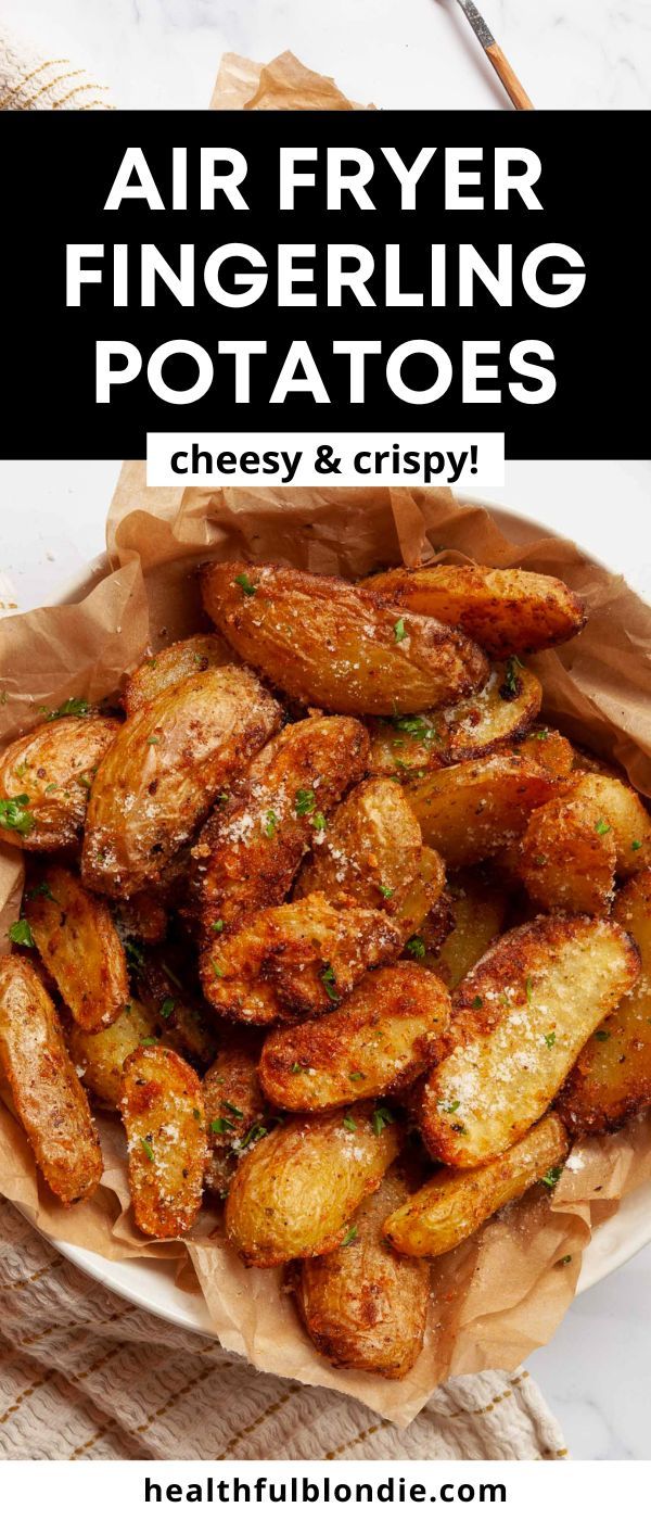 air fryer fingerling potatoes in a basket with text overlay that reads, air fryer fingerling potatoes cheesy and crispy