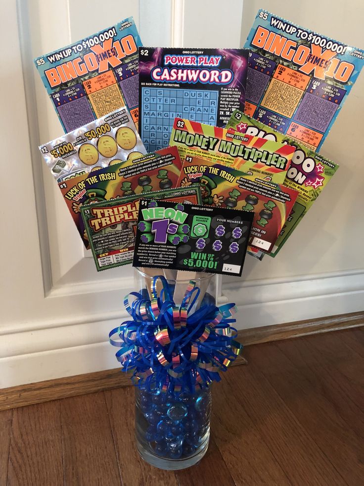 a glass vase filled with candy and magazines