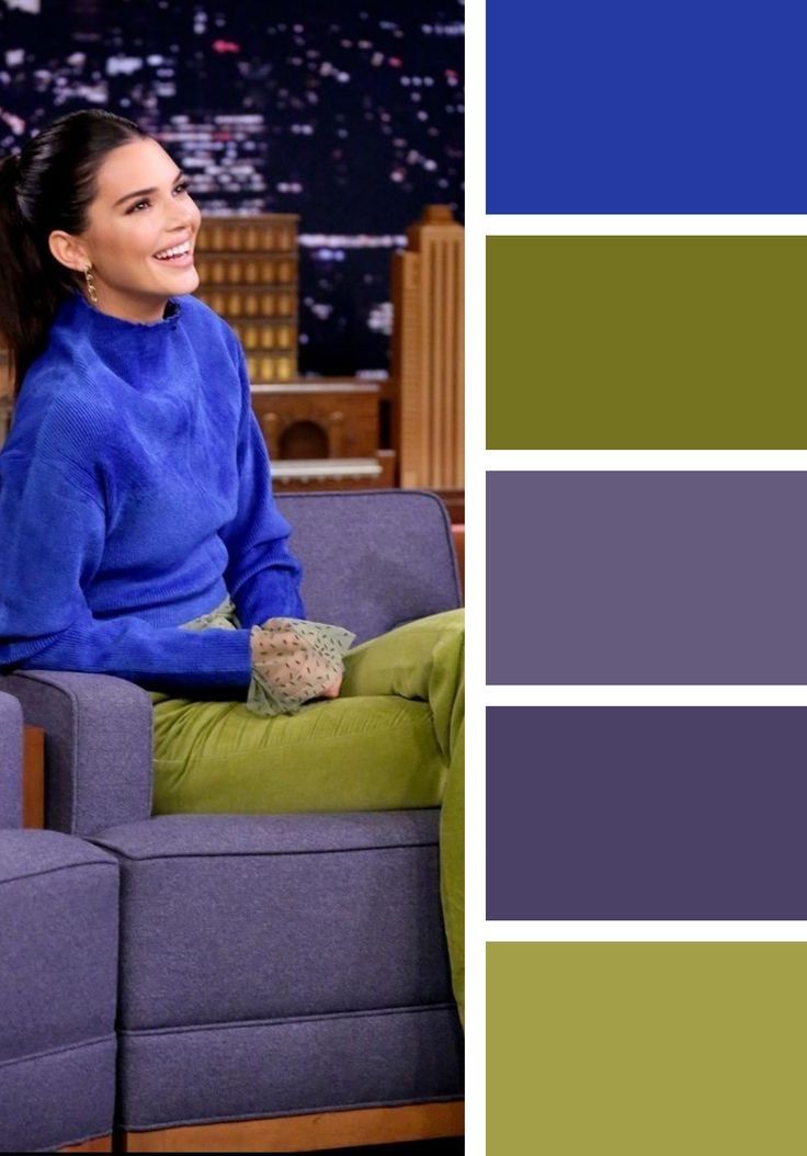 a woman sitting on top of a couch in front of a blue and green color scheme