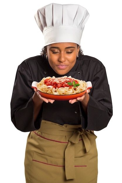 a woman wearing a chef's hat is holding a dish