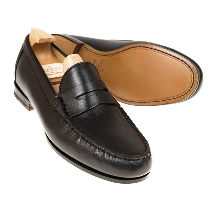 PENNY LOAFERS IN BLACK NUOVO CALF Timeless Black Slip-on Loafers, Luxury Black Slip-on Oxfords, Black Plain Toe Loafers With Leather Sole, Timeless Black Moccasins For Business, Black Almond Toe Loafers With Leather Sole, Timeless Black Business Moccasins, Black Plain Toe Loafers With Rubber Heel Cap, Elegant Black Goodyear Welted Moccasins, Black Business Moccasins With Branded Insole