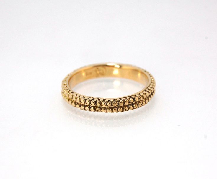 This is cast from a granulated original and is pictured in 14k yellow gold, but I can also cast this in Sterling or 18k yellow. Or would be happy to make a similar design for you in original 18k granulation!Granulation is a controlled fusing process that has been utilized for thousands of years. This unique surface will get more interesting with wear. The granules are individually placed and fused with a mouth torch. I then make a mold of the ring and pull a wax copy from that mold and cast it u Cast Band, Rings Rings, Lost Wax, Memento Mori, Ring Collections, Jewelry Handmade, Yellow Gold Rings, Handmade Silver, Ring Earrings