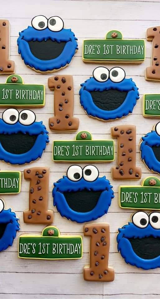 cookie cookies decorated to look like sesame street characters with the number one on each cookie