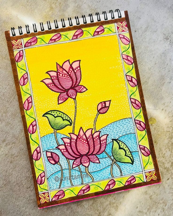 a notebook with an image of flowers on it