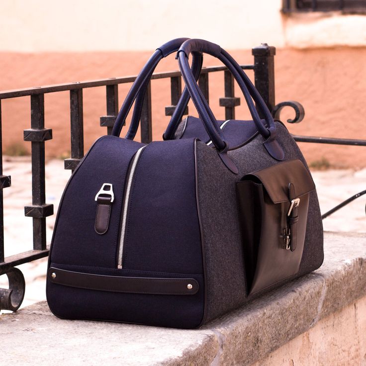 Ideal for overnight or weekend trips, the travel duffle is the best option to carry all your essentials in style. There’s virtually no place where a leather duffel bag would feel awkward or out of place. It measures 21.6 x 11.8 x 11.0 inches / 55 x 30 x 28 cm and features an outside pocket perfect for the little items that could otherwise get lost at the bottom of your bag, full lined interior and a removable shoulder strap. THE DETAILS: Materials: flannel dark grey + flannel navy + black painte Designed Shoes, Leather Duffel Bag, Leather Duffel, Custom Design Shoes, Travel Duffle Bag, Neil Armstrong, Mens Travel, Blue Flannel, Diy Bags