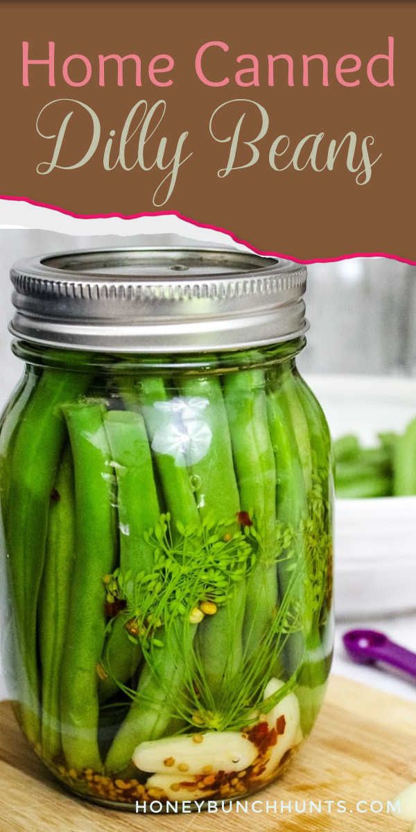 a jar filled with green beans sitting on top of a wooden cutting board