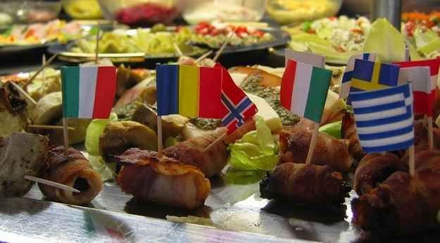 food with flags on skewers in front of other foods