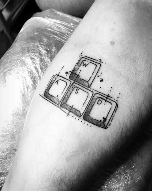 a black and white photo of a man's leg with three pieces of luggage on it