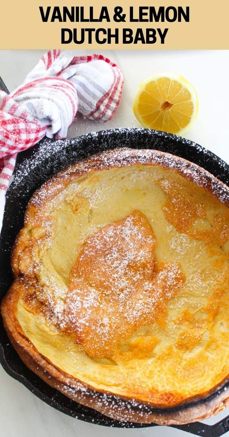 a skillet with some food in it on a white table next to a lemon slice