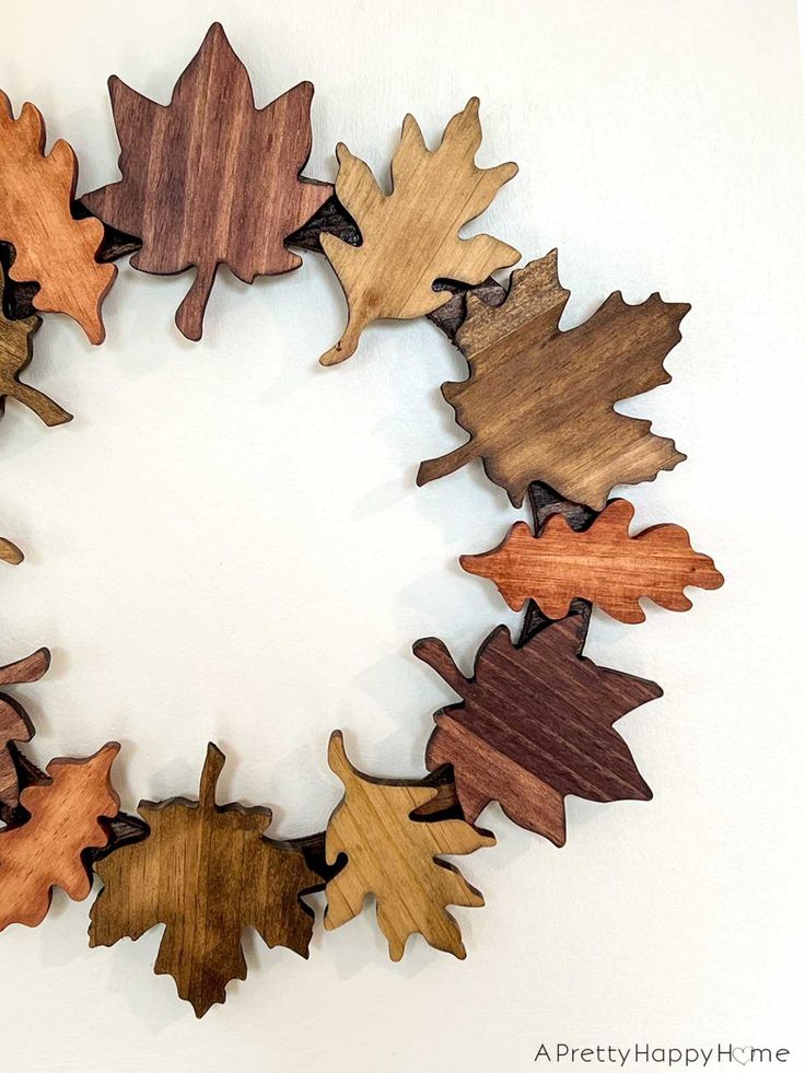 a group of wooden leaves arranged in a circle