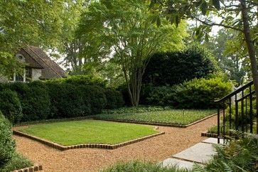 an outdoor garden with lots of grass and trees