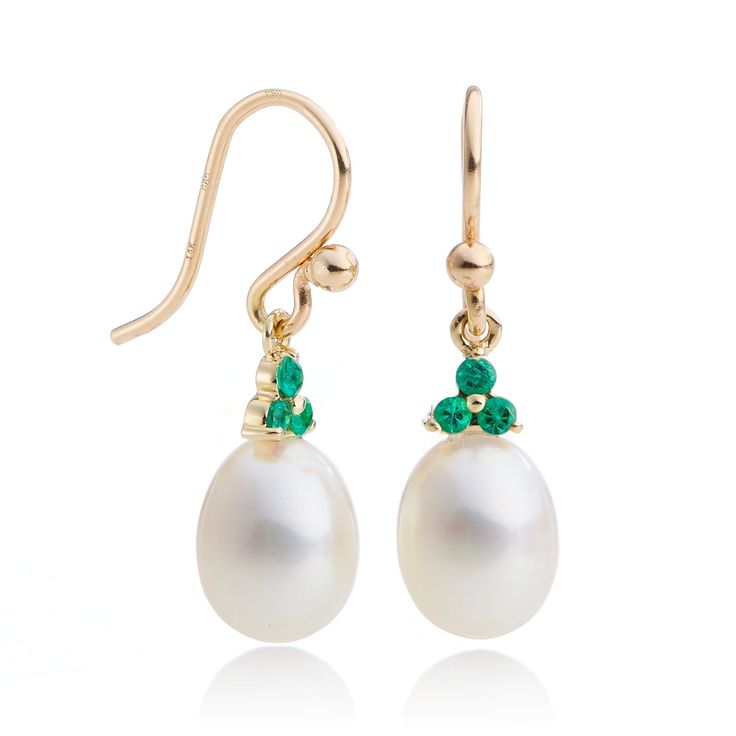 Made of yellow gold, these freshwater pearl earrings are embellished with sparkling emeralds. The timeless design provides an elegant touch to any attire. Freshwater cultured pearls, 9 x 8.5 mm. Emeralds, 0.22ctw. 14-karat yellow gold. Pierced only. Overall: 1"L Elegant Pear-shaped Emerald Earrings, Elegant Green Pearl Earrings For May Birthstone, Formal Green Pearl Drop Earrings, Classic Pear-shaped May Birthstone Earrings, Formal Pearl Drop Earrings For May Birthstone, May Birthstone Pearl Drop Earrings, Classic Green Pearl Drop Earrings, Pearl Drop Earrings For May Birthstone, Elegant Pearl Drop Jewelry For May Birthstone