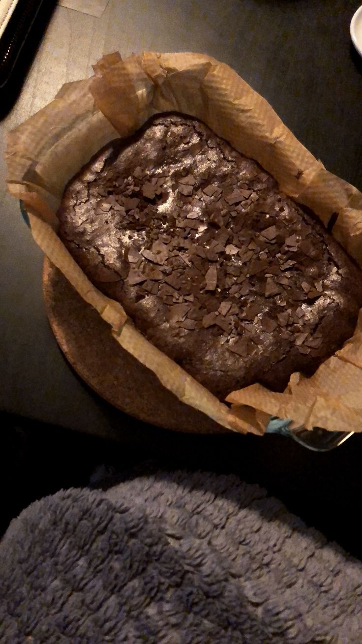 a loaf of chocolate cake sitting on top of a table