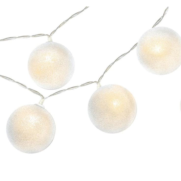 three white christmas balls hanging from a string