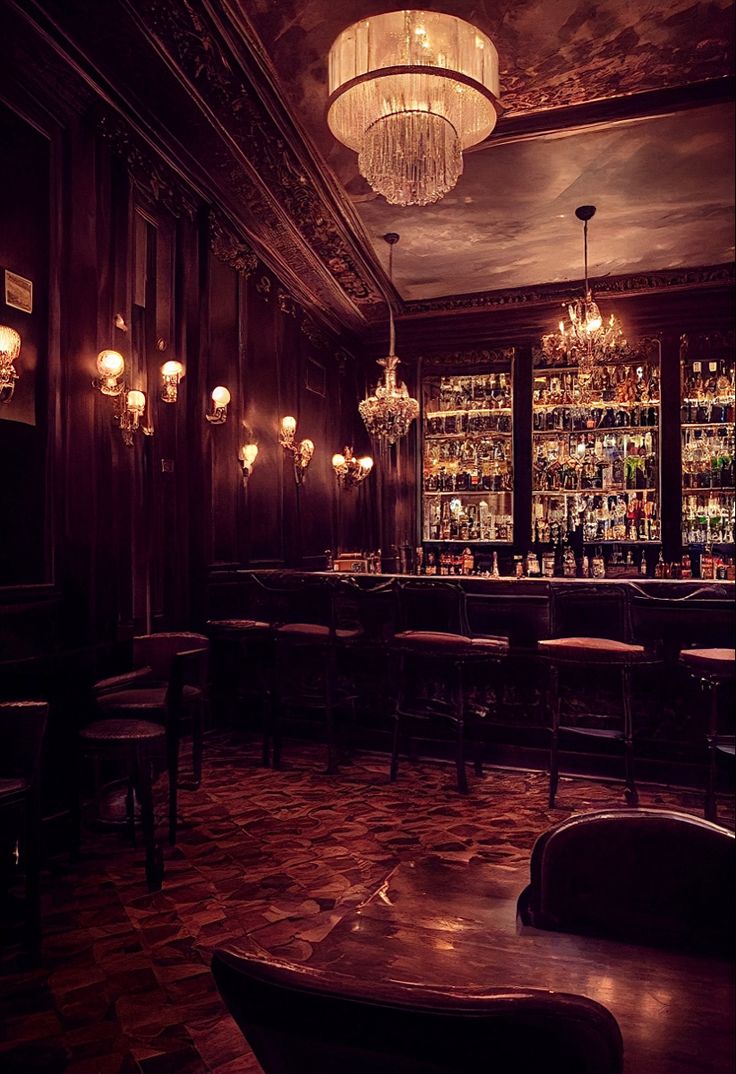 a dimly lit bar with chandeliers and chairs