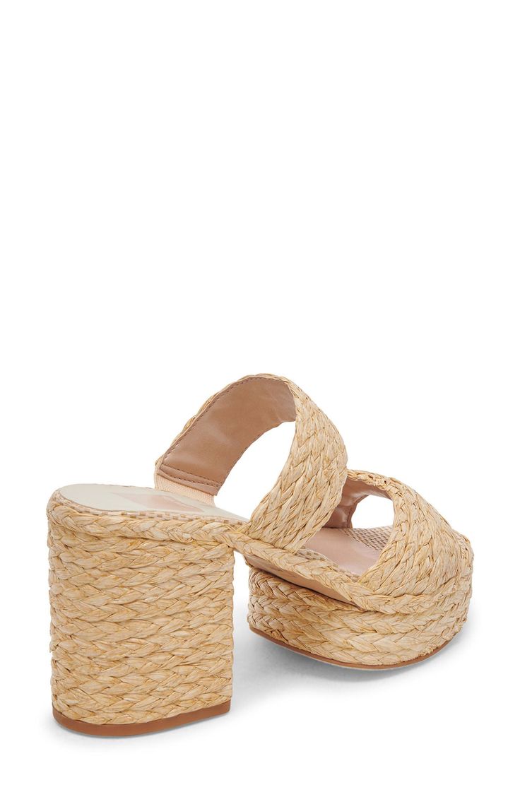 Braided raffia lends artisanal-inspired texture to a sun-ready slide sandal lifted by a chunky block heel and platform for all-day comfort with every step. 3 1/2" heel; 1 1/4" platform Synthetic upper, lining and sole Made in Brazil Chic Woven Mules For Beach, Chic Woven Mules For The Beach, Beige Straw Mules For Vacation, Woven Mules For Summer, Spring Vacation Mules In Natural Color, Natural Color Wedge Sandals With Woven Sole For Summer, Chic Woven Sandals For Summer Outings, Summer Sandals With Textured Footbed In Natural Color, Chic Straw Mules For Vacation