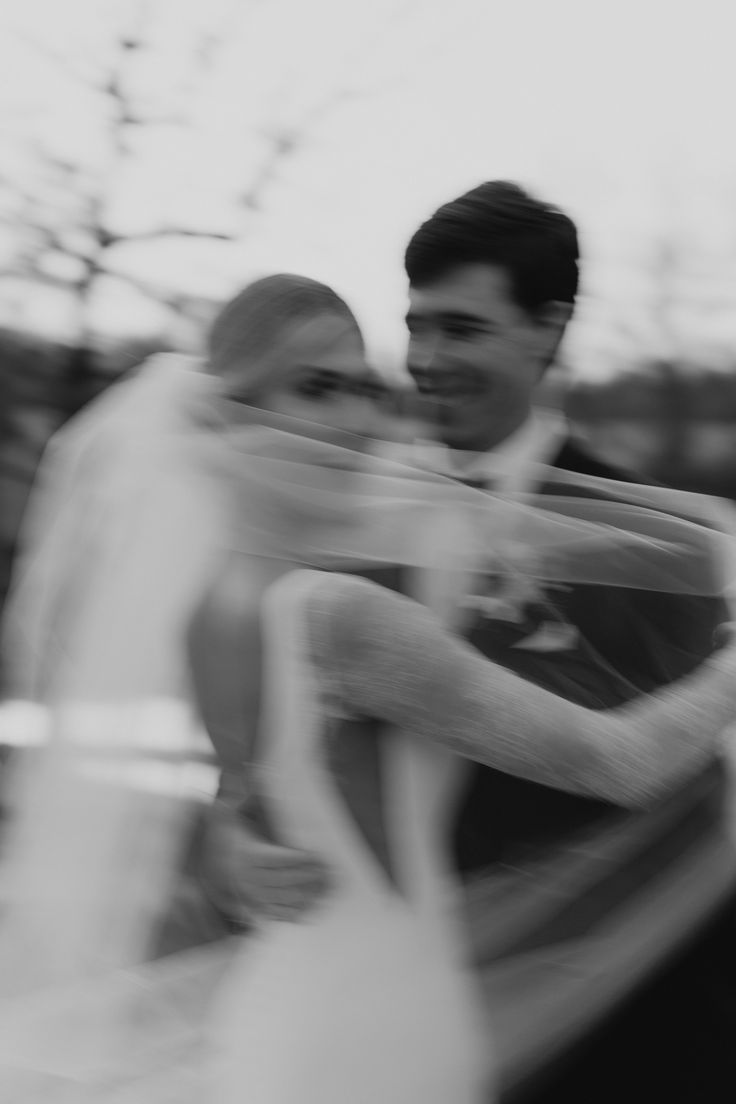 black and white photograph of two people hugging each other