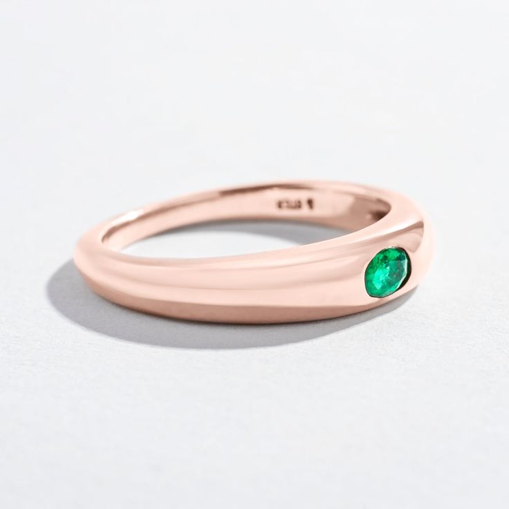 Keep it simple with Angela Monaco's Single Gem Dome Ring; a high polished tapered band embedded with a single emerald stone. Details Made in solid sterling silver, 14K Yellow Gold, or 14K Rose Gold(1)3x4mm oval cut faceted emerald Band measures at 2mm at its thinnest point and 4.3mm at its thickest Classic Emerald Ring With Round Band For May Birthstone, Minimalist Emerald Ring For Formal Occasions, Modern Emerald Oval Signet Ring, Fine Jewelry Emerald Ring With Polished Finish, Emerald Promise Ring With Polished Finish For May Birthstone, Modern 14k Gold Emerald Ring For May Birthstone, Oval Emerald Ring With Tension Setting In Fine Jewelry, Classic Oval Emerald Ring With Tension Setting, Everyday Oval Emerald Ring In Yellow Gold