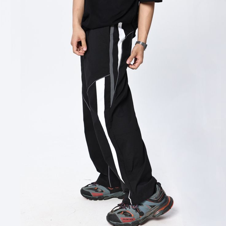 Take your fitness style to the next level with these Casual Functional Wide-leg Sweatpants. The wide-leg design encourages freedom of movement, while the lightweight, breathable fabric offers a comfortable fit. Take on your next challenge with confidence! Features: -80% Polyester, 20% Spandex -Mid-rise Waist -Drawstring Waistband -Stripe design -Regular Fit -Street Style Stretch Wide-leg Athleisure Joggers, Sporty Moisture-wicking Wide Leg Activewear, Moisture-wicking Wide Leg Activewear For Sports, Athleisure Wide-leg Sweatpants For Streetwear, Stretch Parachute Trousers Athleisure Style, Casual Black Moisture-wicking Yoga Pants, Stretch Parachute Pants Athleisure Style, Breathable Stretch Techwear Bottoms, Stretch Parachute Trousers For Athleisure