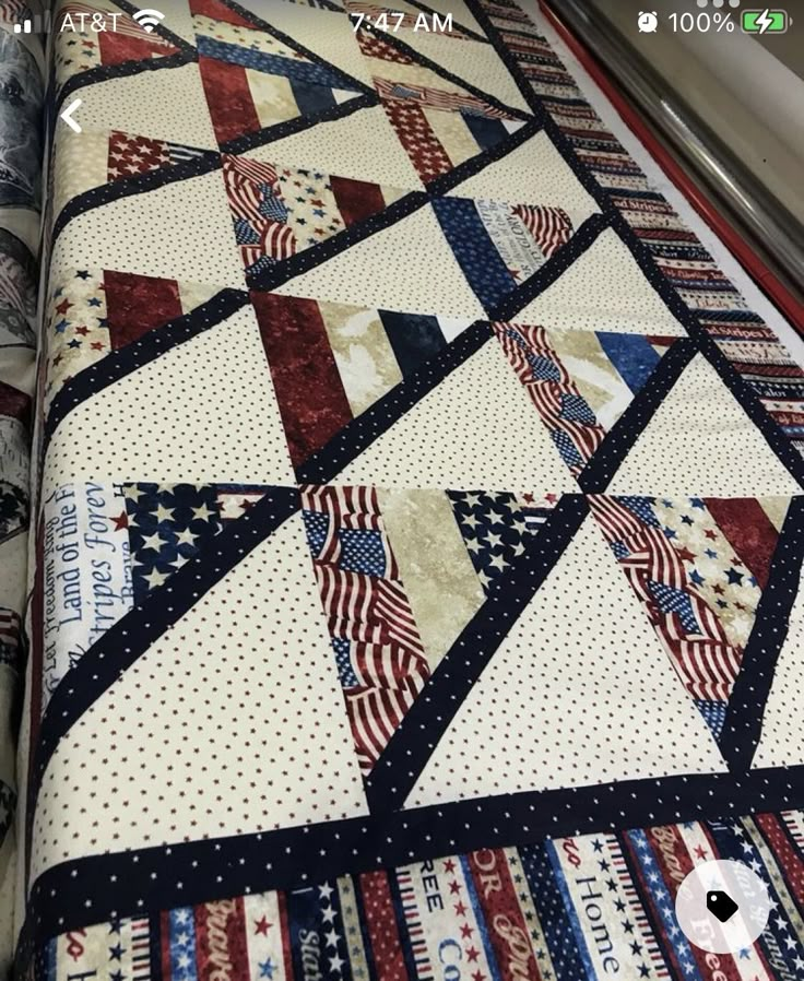 an american flag quilt on display in a store