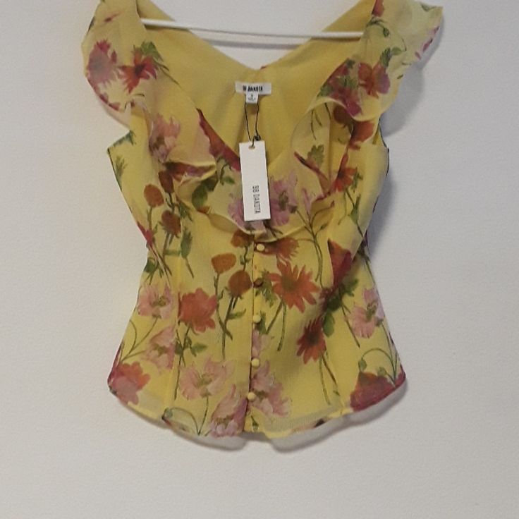 New Bb Dakota Sleeveless Yellow With Floral Pattern Of Pink & Rose Colored Flowers. Size Small Has Original Tags Fully-Lined Cloth Covered Buttons With Same Fabric Armpit To Armpit Measures Approx. 18" Beautiful Flowery Blouse! Yellow Floral Print Tank Top For Spring, Fitted Tank Summer Blouse, Sleeveless Summer Top With Button Closure, Fitted Tank Blouse For Summer, Yellow Summer Blouse With Button Closure, Yellow Sleeveless Blouse Tank Top For Spring, Yellow Sleeveless Blouse For Spring, Chic Yellow Tops With Button Closure, Casual Sleeveless Yellow Blouse