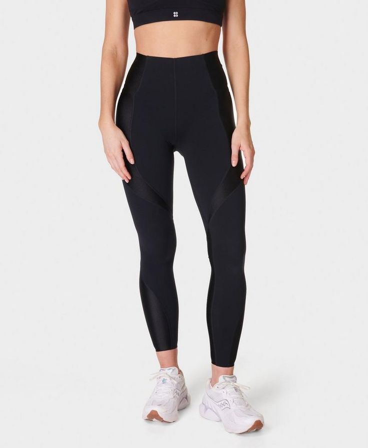 An ultra-compressive, high-waisted workout legging made from our famous Power fabric. Sweat-wicking and quick-drying with bum-sculpting seamlines. Sleek, super-high-rise design with two side pockets and high-shine panels. Bonded waistband sculpts, supports and compresses to aid recovery post-workout. Inseam length: 23" / 58cm. Model wears size S and is 178cm/5'10" tall. Style Code: SB932078Colour: Black Modern Compressive Sports Bottoms, Functional Nylon Leggings With Contoured Waistband, Modern Stretch Activewear For Training, Functional High Waist Compressive Leggings, Athleisure Nylon Leggings With Contoured Waistband, Sporty High Rise Activewear For Training, Sporty Nylon Leggings With Contoured Waistband, Sporty High-rise Tights For Workout, Sleek Nylon Activewear For Sports