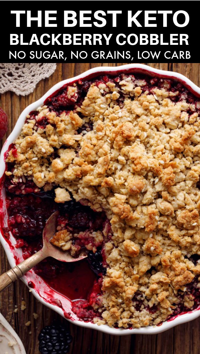 a berry crumbled dessert in a bowl with a spoon