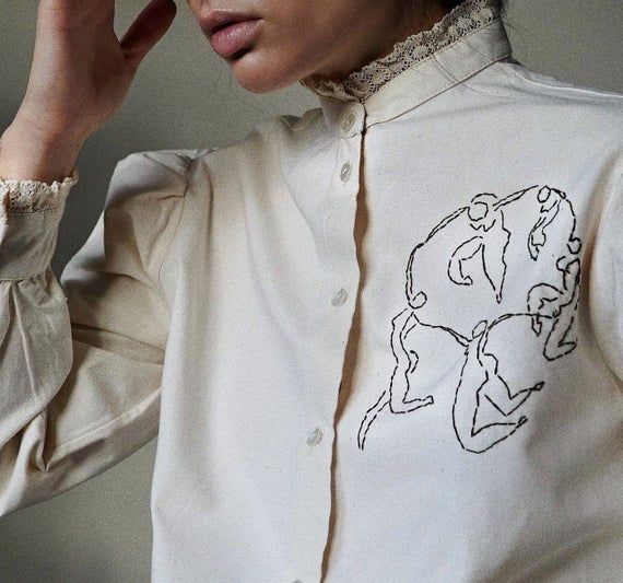 Hand embroidered beige lace shirt. Lace collar and details. Our new drop of custom made blouses. Organic cotton, feminine cut and hand embroidery with love. Slooow hands takes it to the new level, making your look even more perfect and unique. Henri Matisse - pencil sketch. Oversized. Wide sleeves. Measurements (cm) M/L size: Shoulders: 43, Sleeve: 60, Bust: 103, Blouse length: 58. Dusty Pink Blouse, Reworked Vintage, Shirt Embroidery, Embroidered Clothes, Lace Collar, Lace Shirt, Henri Matisse, Blouse Length, Embroidered Shirt