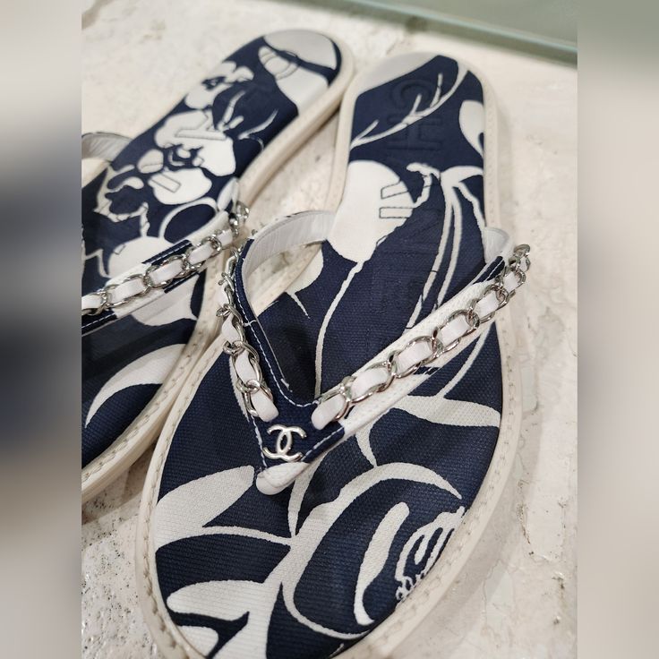 Gently Used Designer Open Toe Flip Flops For Spring, Designer Open Toe Flip Flops For Vacation, Designer Flat Flip Flops For Beach, Luxury Blue Sandals For Summer, Designer Flip Flops For Summer Vacation, Designer Flip Flops For Spring Beach Season, Designer Summer Flip Flops For Vacation, Designer Flip Flops For Beach In Spring, Designer Flip Flops For Beach