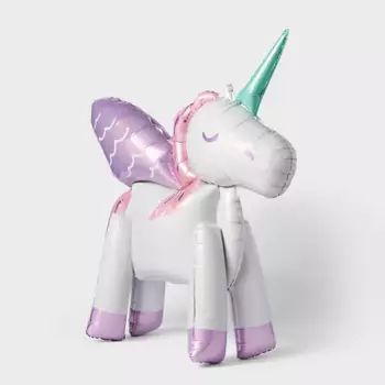 an inflatable unicorn toy sitting on top of a white table