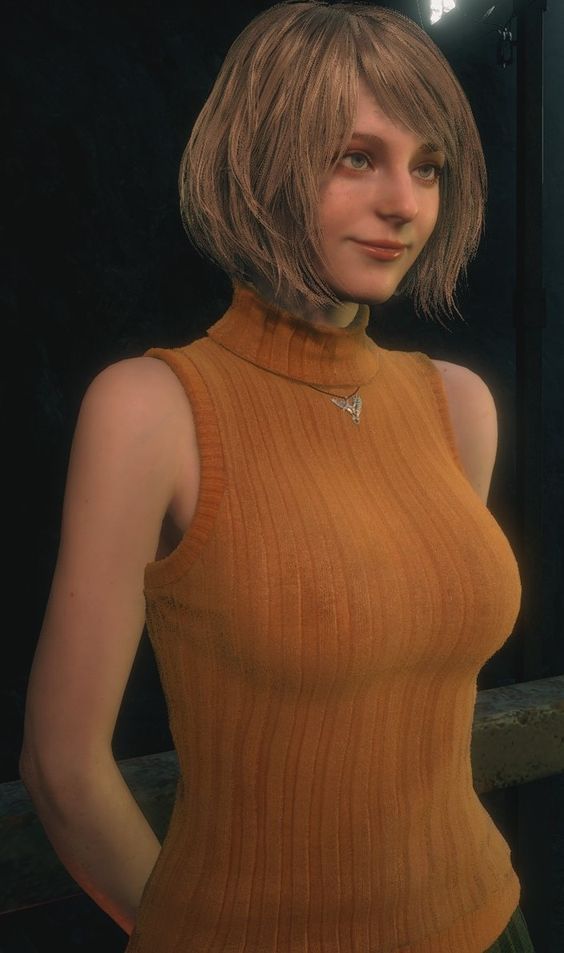 a woman with blonde hair wearing an orange top