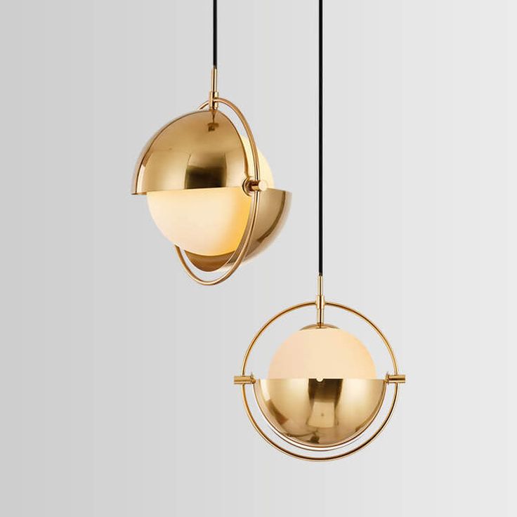 two brass colored lights hanging from the ceiling