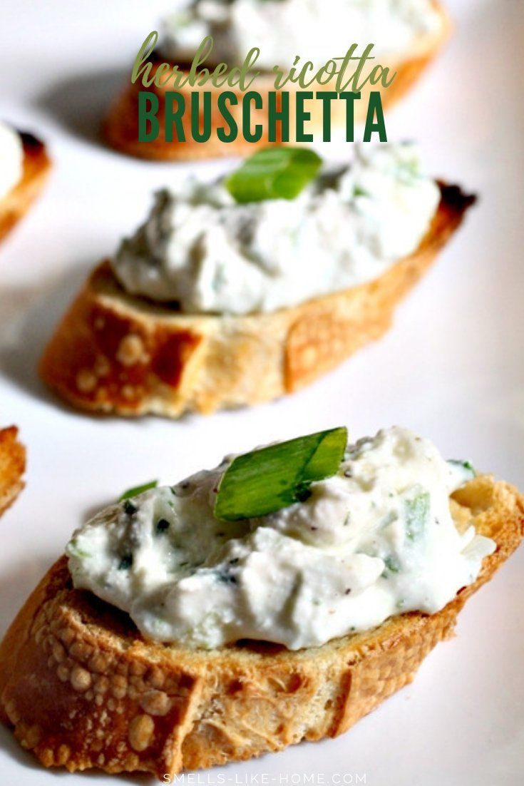 three pieces of bread topped with cream cheese and green leafy garnishments