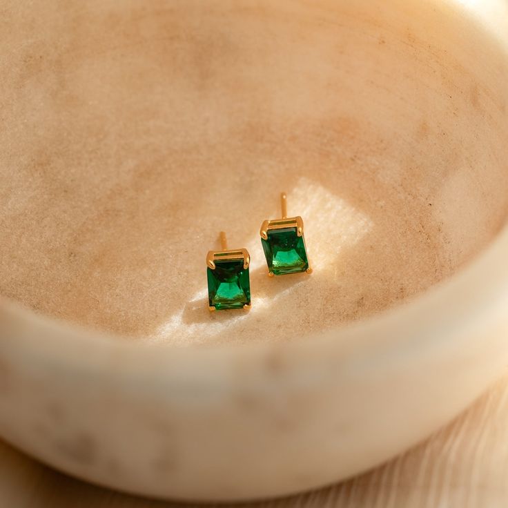 Everything about our Emerald Cut Birthstone Studs make them a must-have staple for your collection. From its personalized touch to its minimalist style — these gemstone earrings coordinate effortlessly with any outfit. Wear them as everyday earrings to work and play, or pair them with a fancier outfit for a night out! They also make special personalized gifts for all the women in your life. Makes sense why they're such a crowd favorite! Material: High Quality Solid 925 Sterling Silver Finish: 18 Minimalist Gold Plated Gemstone Earrings, Minimalist Gold-plated Gemstone Earrings, Fine Jewelry Birthstone Earrings For Everyday, Everyday Gold Plated Birthstone Earrings, Minimalist 14k Gold May Birthstone Earrings, Everyday Fine Jewelry Earrings With Birthstone, Minimalist Yellow Gold Earrings For May Birthstone, Minimalist 14k Gold Earrings With Gemstone, Dainty Everyday Gemstone Earrings