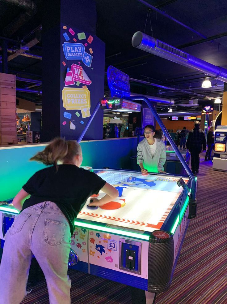 two people playing a game at the mall