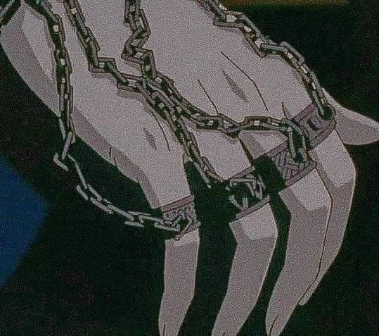 an anime character with chains on his hands