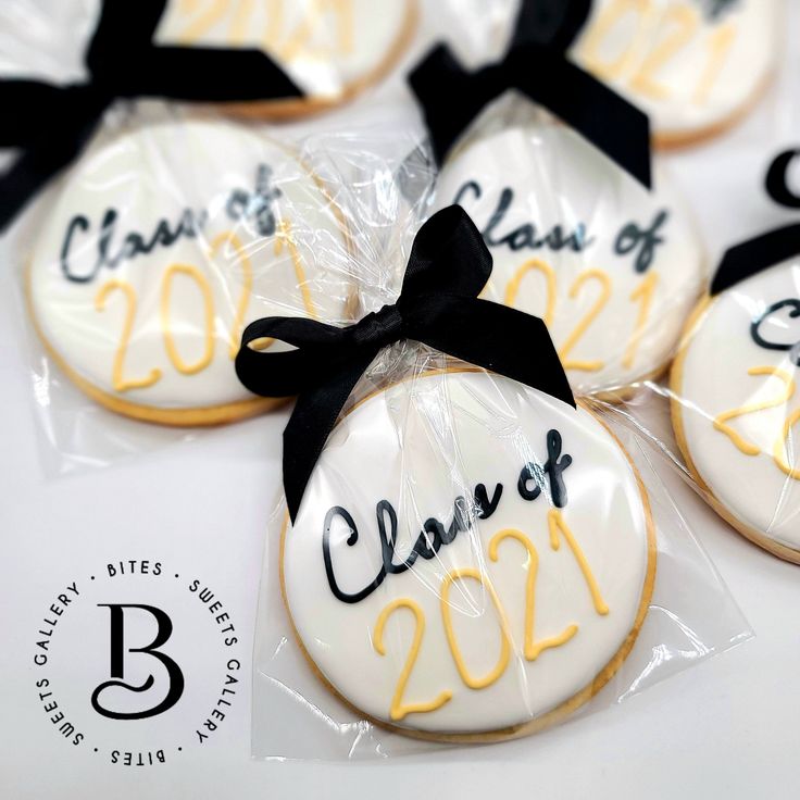 cookies decorated with the names of class of 2021 and graduation date are wrapped in cellophane