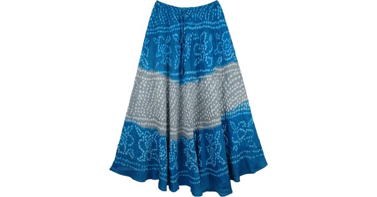 This is a hand tied and dyed long cotton skirt for summer. The color of the skirt is in stylish bohemian combination of Abbey Grey and Lochmara Blue. There are delicate small white tie dye patterns all over the long skirt. The material is comfortable cotton, ideal for summers. The skirt is lined from inside to half length. This skirt has a relaxed fit for carefree movement. The skirt has a wide hemline. It has an elastic and a drawstring for sizing flexibility. Length: about 38" (can vary a litt Summer Bohemian Batik Print Skirt, Bohemian Batik Print Skirt For Summer, Bohemian Batik Print Summer Skirt, Bohemian Cotton Skirt With Batik Print, Traditional Cotton Maxi Skirt For Beach, Traditional Cotton Skirt For The Beach, Summer Long Skirt, Bridesmaids Outfits, Long Cotton Skirt