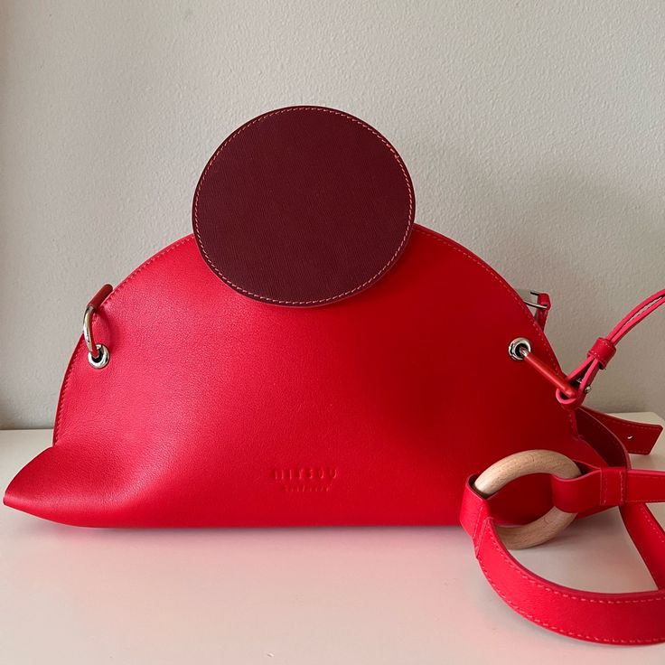 This Bag Is Handmade By A Small Group Of Designers, Using High-Quality Leather, And The Inner Lining Is Also Made Of Genuine Leather. The Appearance Is Very Fashionable And Attractive. Brand New With Dust Bag. Red Bag With Round Handle For Everyday Use, Red Shoulder Bag With Round Handle For Daily Use, Chic Red Bags With Round Handle, Red Bags With Detachable Strap And Round Handle, Modern Red Bags With Magnetic Closure, Modern Red Shoulder Bag With Leather Handles, Red Shoulder Bag With Detachable Round Handle, Luxury Red Shoulder Bag With Round Handle, Red Crossbody Bag With Magnetic Closure