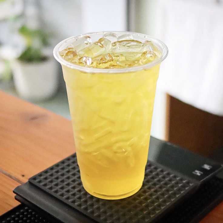 a drink sitting on top of a wooden table